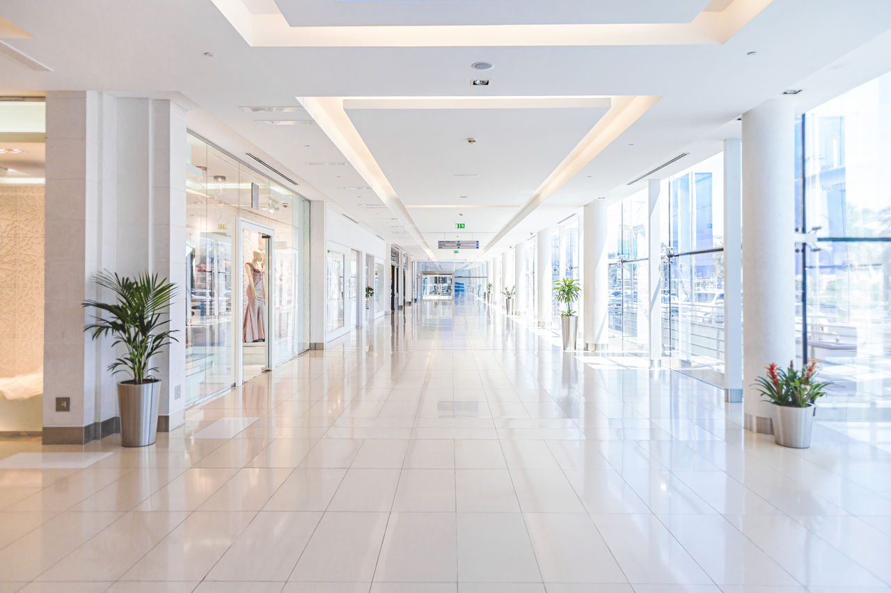 647802542 Background of empty corridor in modern shopping mall